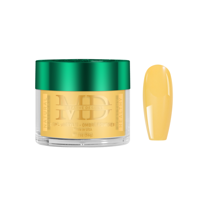 Gold-colored powder in a jar with a green lid, next to a yellow nail color swatch on a white background.