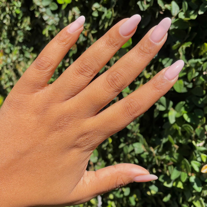 Lilac Luxe - Builder Gel on medium almond-shaped nails with sheer pinky-purple manicure in natural light outdoors