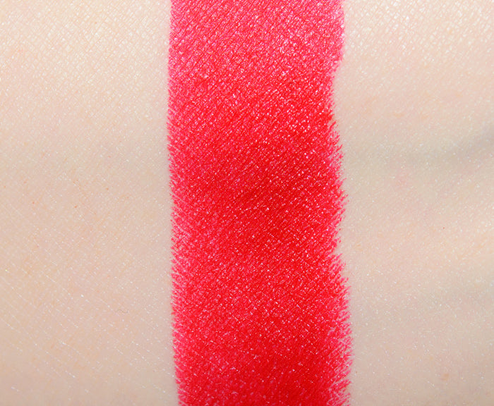 MAC x Teyana Taylor beauty product featuring two shades of NWOB lipstick with swatches on skin, showcasing vibrant colors and texture.