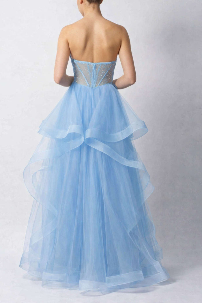 Back view of Strapless Baby Blue Tulle Prom Dress Mascara MC29514 showcasing sheer paneling and cascading tulle layers for elegant flair.