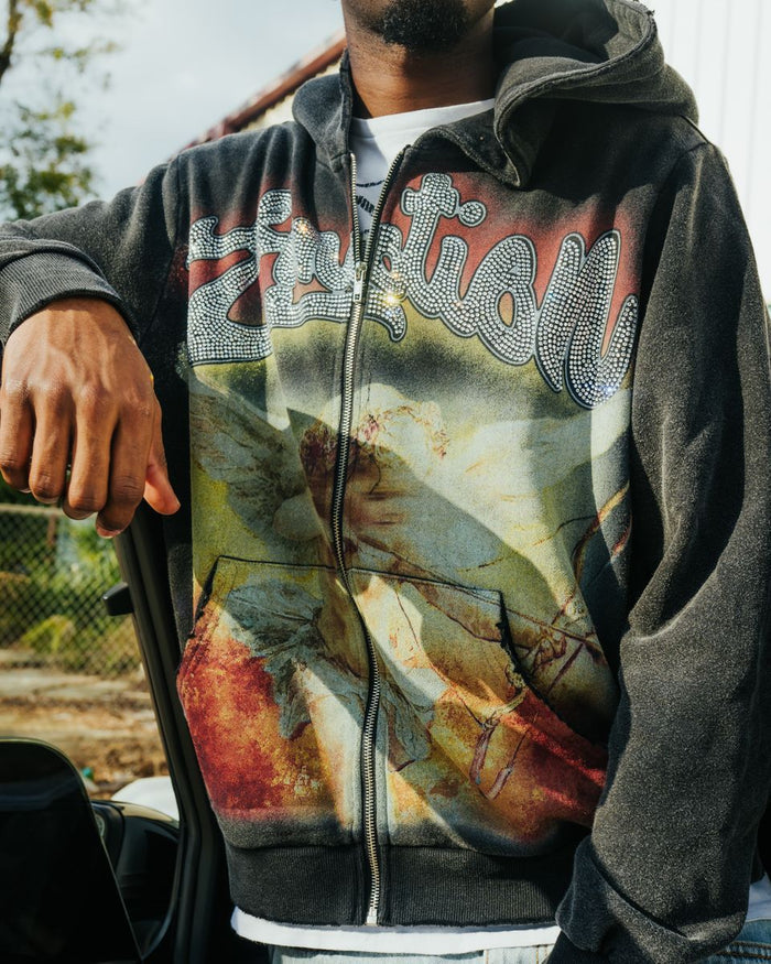 Front view highlighting the black acid wash fabric, rhinestone embellishments, and zip closure of the hoodie