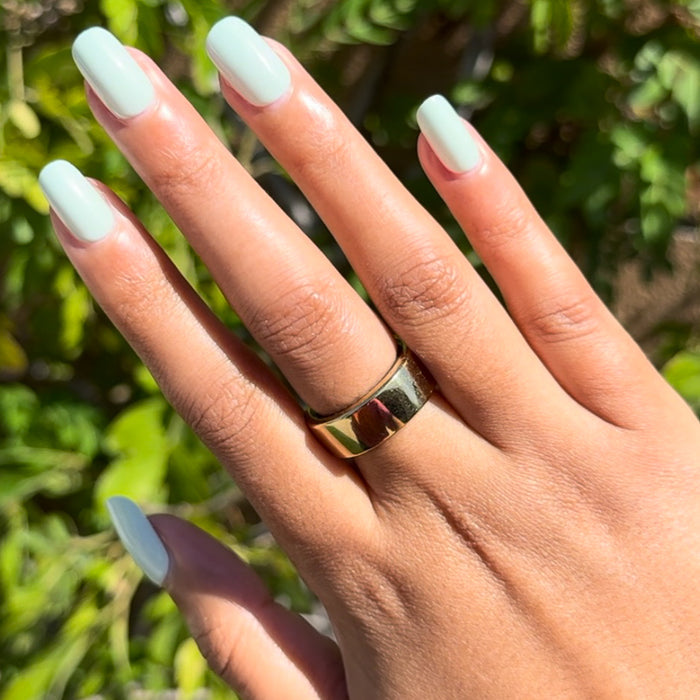Seafoam | Short | Squoval - Tab Press-On pastel green press-on nails with smooth finish on hand outdoors in natural light