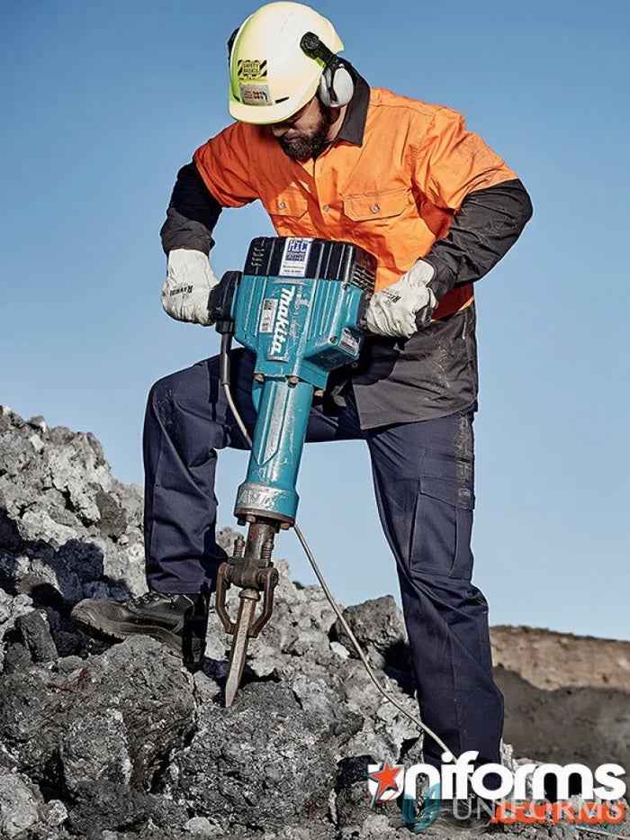 Man using jackhammer in Syzmik Mens Cargo Pants ZP501 with reinforced stress points