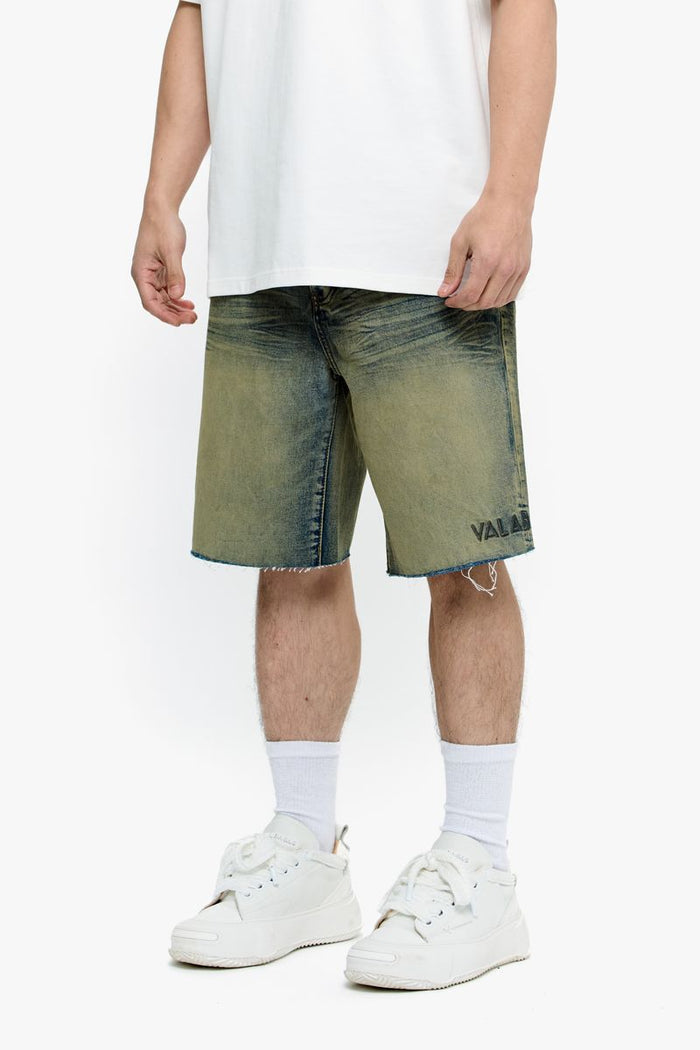 Front view of medium vintage denim shorts featuring traditional pockets and button closure