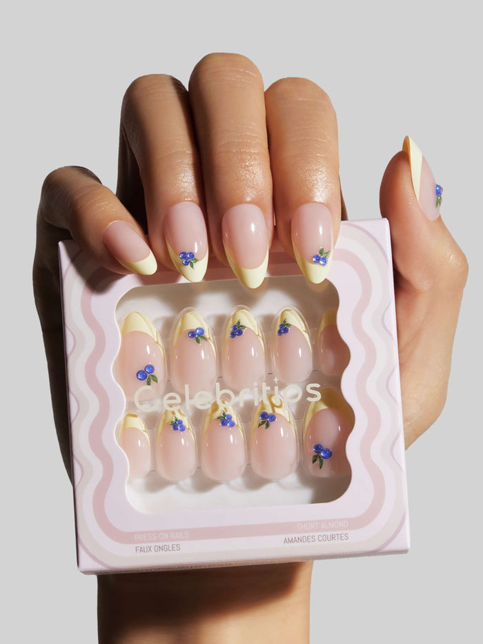 Nail art display with decorative press-on nails and 'Celebritips' branding.