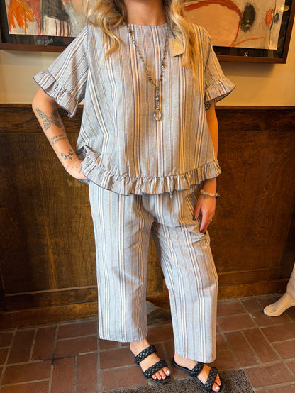 Camille & Co. Earn Your Stripes pants featuring bold striped pattern, relaxed fit, and stylish bottom wear for casual or chic looks.