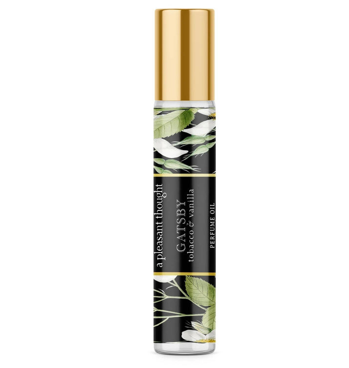 A bottle of A Pleasant Thought Gatsby perfume oil with tobacco and vanilla scent, featuring a sleek, elegant design.