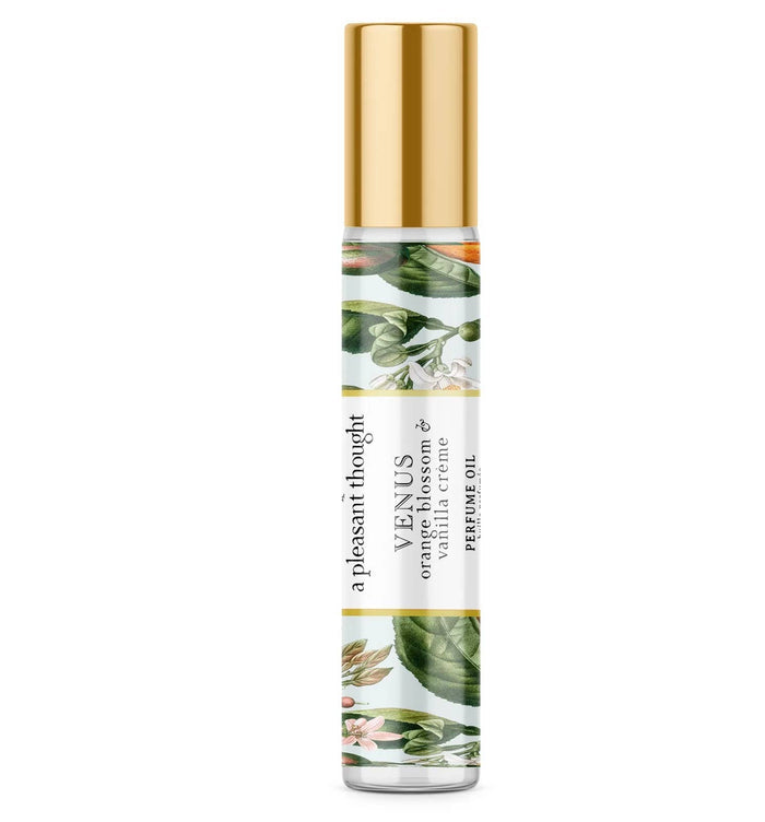 A Pleasant Thought Venus perfume oil bottle featuring orange blossom and vanilla crème scent, with elegant packaging design.