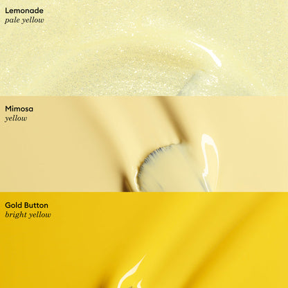 Three horizontal swatches of Manucurist Abricot nail polish in varying yellows: pale yellow labeled “Lemonade,” soft yellow labeled “Mimosa,” and vibrant yellow labeled “Gold Button.”.