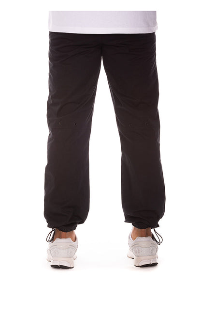 Close-up of the black BB ISS Pants showing the high-quality fabric and branding details for the Billionaire Boy's Club collection