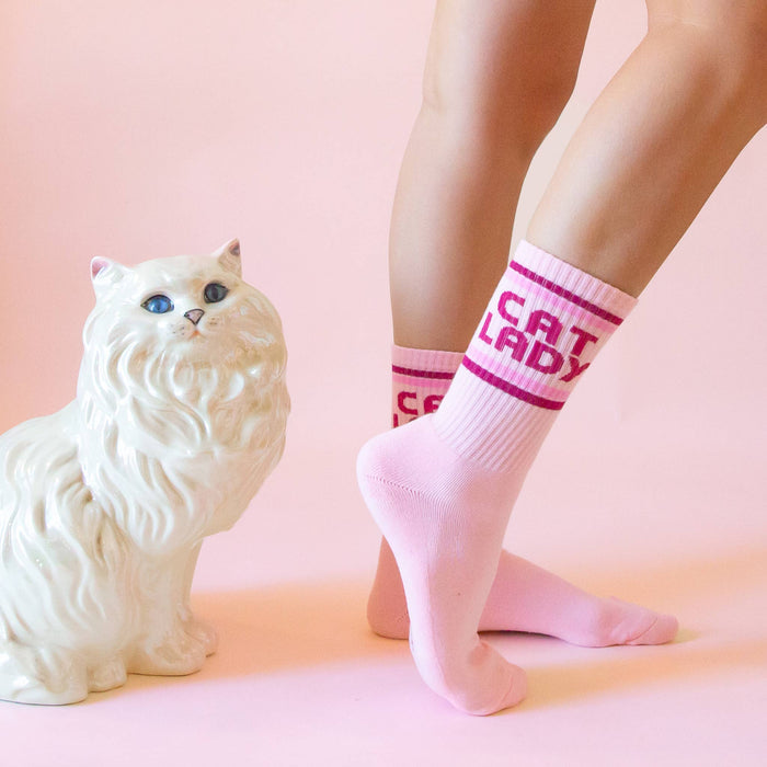 Sunshine Studios cat lady striped ribbed crew socks featuring colorful feline patterns and cozy knit texture.