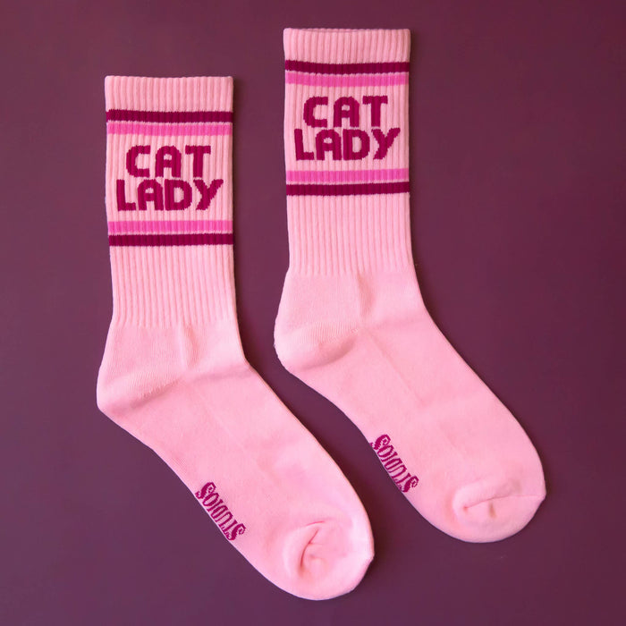 Sunshine Studios Cat Lady striped ribbed crew socks featuring colorful feline patterns and comfortable ribbed design.