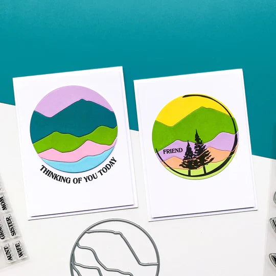Catherine Pooler - Die - Circle Landscape. Take your scene building up a level with the Circle Landscape Die by adding a backdrop of mountains or water. Or just to add some fun pops of colour. Available at Embellish Away located in Bowmanville Ontario Canada. Example by brand ambassador.