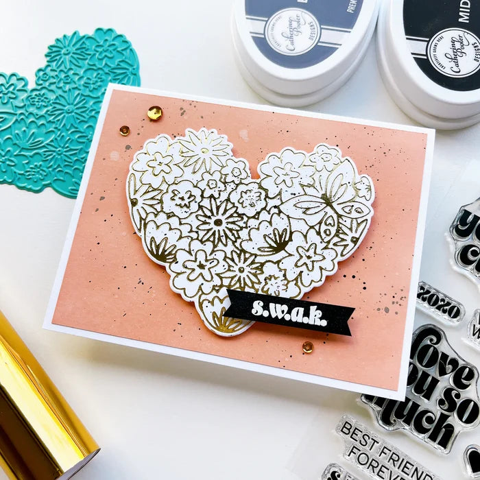 Catherine Pooler - Hot Foil Plate - Hearts Aflutter. Foil a beautiful statement piece with the Hearts Aflutter Foil Plate. This floral heart features a butterfly and is a large image to fill your card front. Available at Embellish Away located in Bowmanville Ontario Canada. Example by brand ambassador.