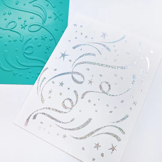 Catherine Pooler - Hot Foil Plate - Hooray for Confetti. Grab some glimmery foil and create a festive background that will sparkle and shine. Perfect for any festive occasion from New Year to Birthdays & more. Available at Embellish Away located in Bowmanville Ontario Canada. Example by brand ambassador.