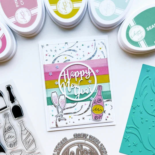 Catherine Pooler - Hot Foil Plate - Hooray for Confetti. Grab some glimmery foil and create a festive background that will sparkle and shine. Perfect for any festive occasion from New Year to Birthdays & more. Available at Embellish Away located in Bowmanville Ontario Canada. Example by brand ambassador.