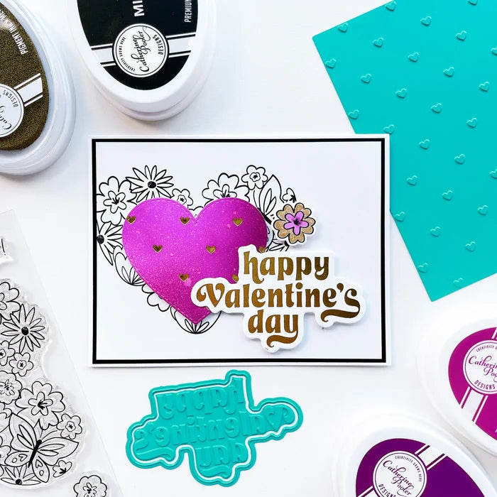 Catherine Pooler - Hot Foil Plates and Dies - Sweet Nothings. Add a foiled sentiment to your next Valentine project with the Sweet Nothings Hot Foil Plates. Featuring a large "love you so much" and "happy Valentine's day" , a small "s.w.a.k" and "xoxo". Available at Embellish Away located in Bowmanville Ontario Canada. Example by brand ambassador.