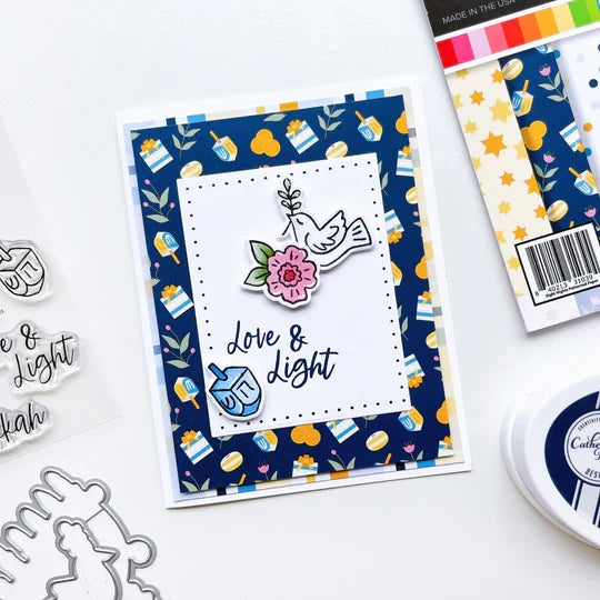 Catherine Pooler - Patterned Paper - Eight Nights. Create gorgeous Hanukkah cards and paper projects with the Eight Nights Patterned Paper. Traditional colors of Whipped Honey, Shea Butter, Sauna, Tranquil, On the Lake, Juniper Mist, Rose Petals & Sage. Available at Embellish Away located in Bowmanville Ontario Canada. Example by brand ambassador.