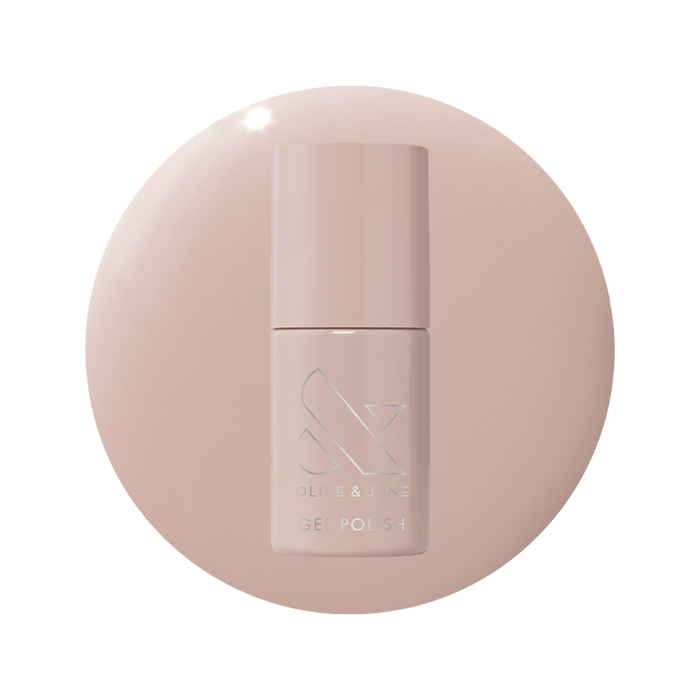 Bottle of CDJ - Gel nail polish by Olive and June in a creamy neutral shade on matching background