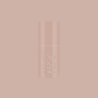 Bottle of CDJ - Gel nail polish by Olive and June in creamy neutral shade on matching soft background