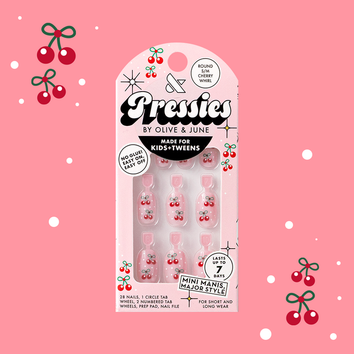 Cherry Whirl - Pressies | Short Medium | Round showing pastel pink press on nails with cherry designs in packaging on pink background