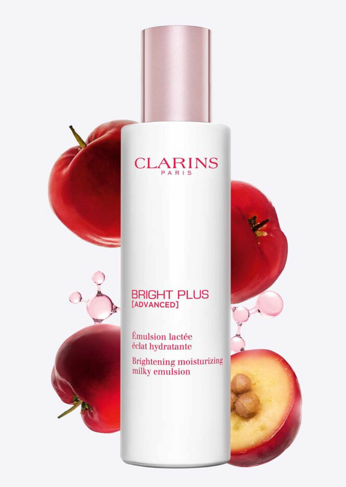 Clarins Bright Plus Milky Emulsion 100ml beauty product bottle with white and silver packaging, displayed on a plain background.