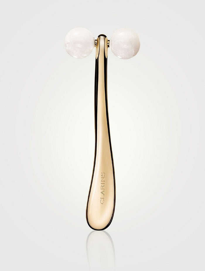 Clarins Precious Le Roll-On beauty product with a sleek silver rollerball applicator for targeted skincare.