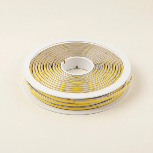 COB LED sticker strip light roll warm yellow - cream background