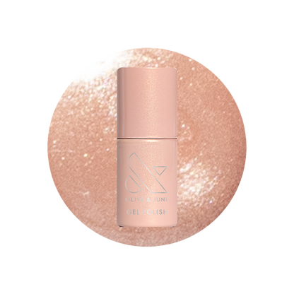 Cookie Swap Gel shimmery beige champagne gel polish bottle on sparkling background for a polished manicure