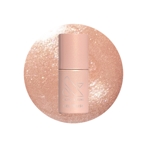Cookie Swap Gel shimmery beige champagne gel polish bottle on sparkling background for a polished manicure