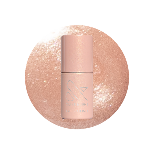 Cookie Swap Gel shimmery beige champagne gel polish bottle on sparkling background for a polished manicure