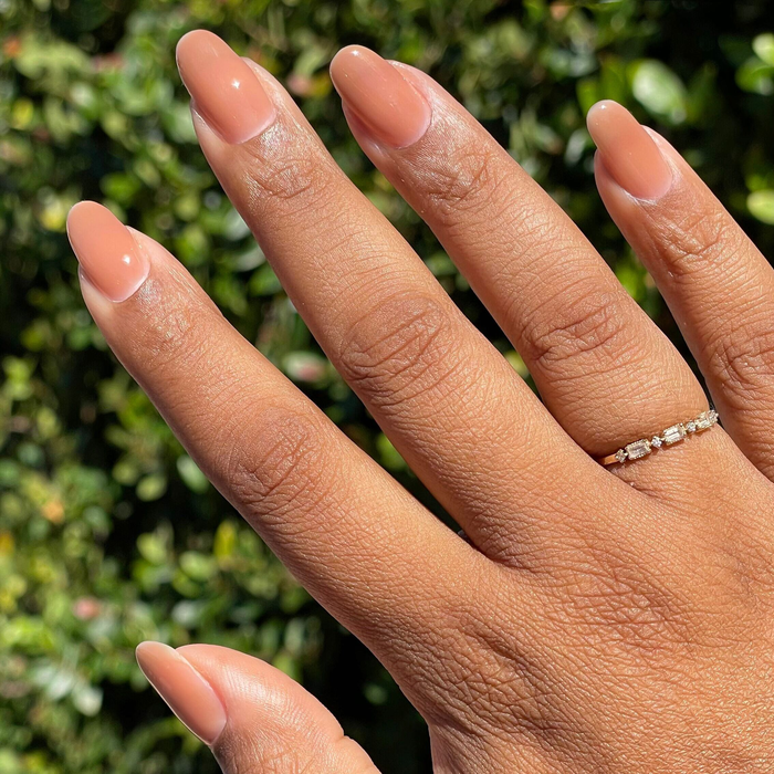 Creme Caramel - Builder Gel on almond nails with a smooth, glossy toasted taupe gel polish manicure outdoors
