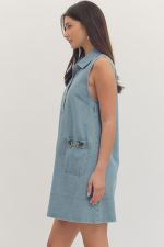 Denim Horsebit Minidress by Entro showing a stylish sleeveless dress with a horsebit detail at the neckline.