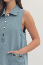 Denim horsebit minidress by Entro with short sleeves, fitted silhouette, and stylish front detailing.
