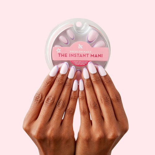 Double French - Press-On | Medium | Oval showing hands with medium oval false nails featuring two-tone french tip design manicure