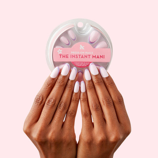 Double French - Press-On | Medium | Oval showing hands with medium oval false nails featuring two-tone french tip design manicure