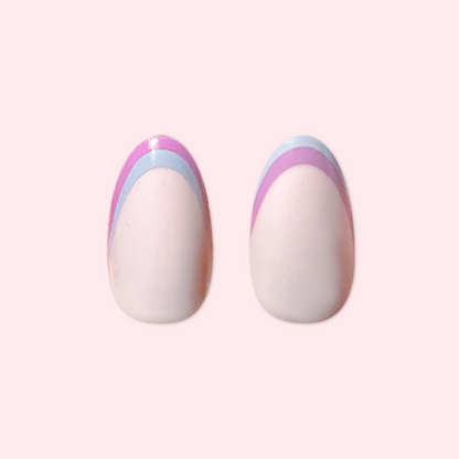 Double French - Press-On | Medium | Oval showing medium oval false nails with two-tone pastel french tip manicure design