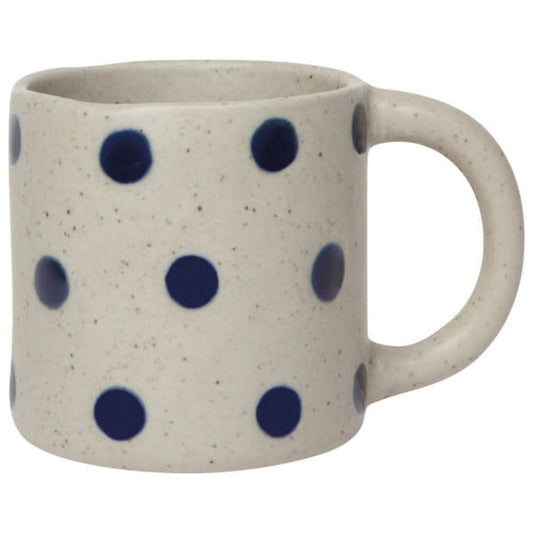 Speckled cream ceramic mug with navy dot pattern and right-side handle