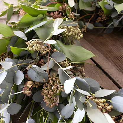 Floppy Greenery Wholesale Wreath in a hand