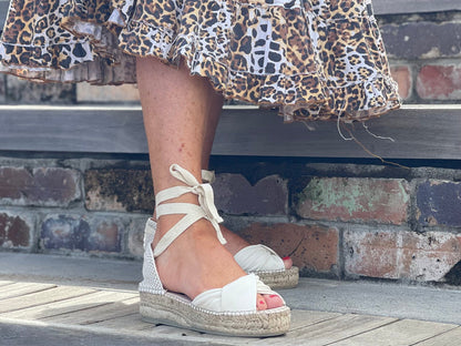 Comfortable, Spanish leather espadrille sandals with enclosed toe. Lace up pattern is cream colour. Quality European women's footwear and shoes.