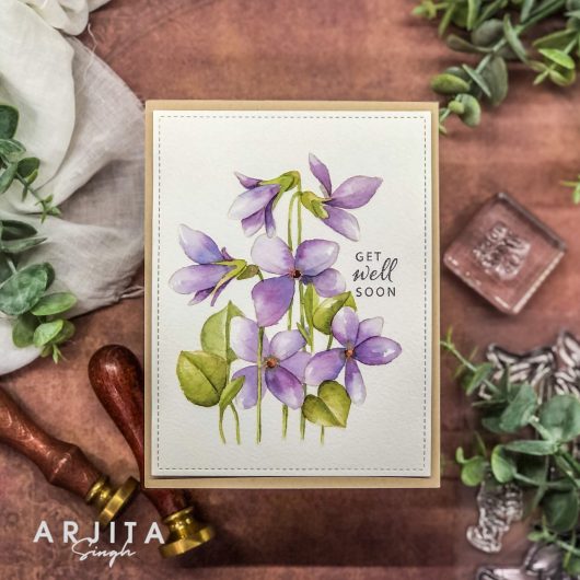 Gina K. Designs - Stamp & Die Set - Blue Violets. Blue Violet is a stamp set by Arjita Singh. This set is made of premium clear photopolymer and measures 6" X 8". The die set gives you the ability to cut out and layer, creating texture to your creation. Available at Embellish Away located in Bowmanville Ontario Canada. Example by brand ambassador.
