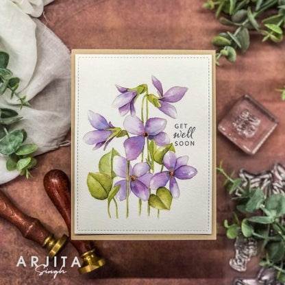 Gina K. Designs - Stamp & Die Set - Blue Violets. Blue Violet is a stamp set by Arjita Singh. This set is made of premium clear photopolymer and measures 6" X 8". The die set gives you the ability to cut out and layer, creating texture to your creation. Available at Embellish Away located in Bowmanville Ontario Canada. Example by brand ambassador.