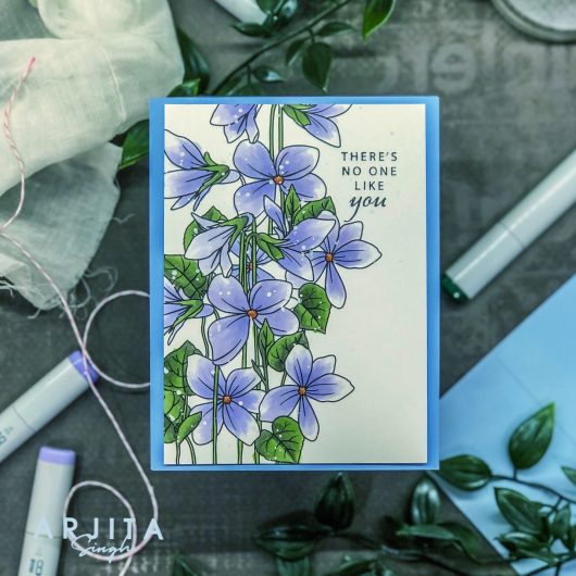 Gina K. Designs - Stamp & Die Set - Blue Violets. Blue Violet is a stamp set by Arjita Singh. This set is made of premium clear photopolymer and measures 6" X 8". The die set gives you the ability to cut out and layer, creating texture to your creation. Available at Embellish Away located in Bowmanville Ontario Canada. Example by brand ambassador.