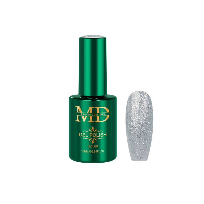 Green gel polish bottle with a glittery silver nail tip next to it on a white background
