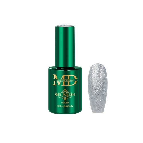 Green gel polish bottle with a glittery silver nail tip next to it on a white background