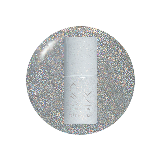Silver nail polish bottle on a glittery silver background