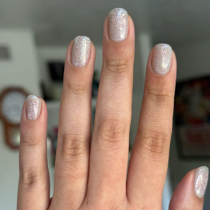 Glitter Department Gel on short natural nails with fine holographic silver sparkle for an elegant at-home mani by Olive and June