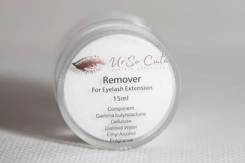 A clear cylindrical bottle with a white label from ur so cute containing 15ml creamy eyelash extensions remover