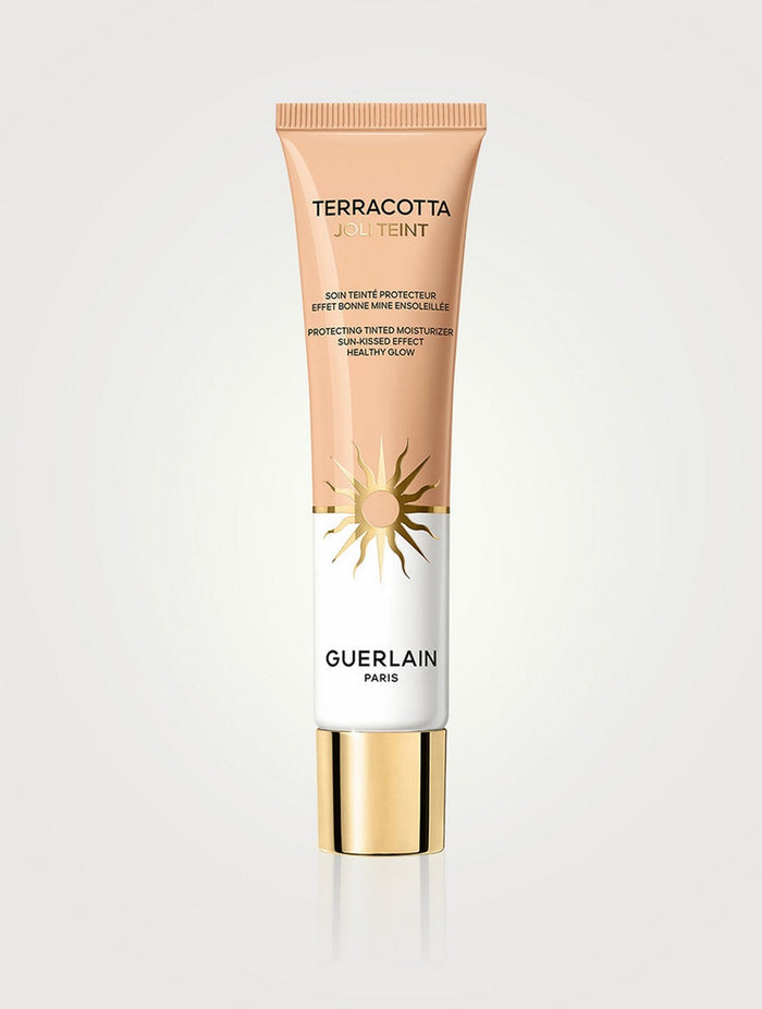Guerlain Terracotta Joli Teint tinted moisturizer in shade NIB, providing a natural, glowing finish with light protection.
