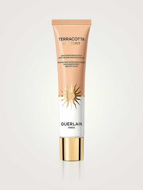 Guerlain Terracotta Joli Teint tinted moisturizer in shade NIB, providing a natural, glowing finish with light protection.